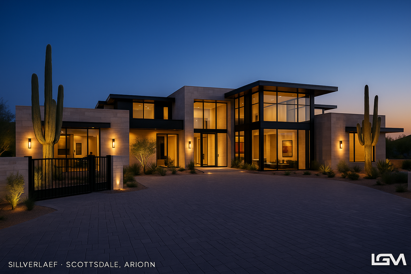 Modern house exterior with cacti at dusk, featuring illuminated windows. lgm
